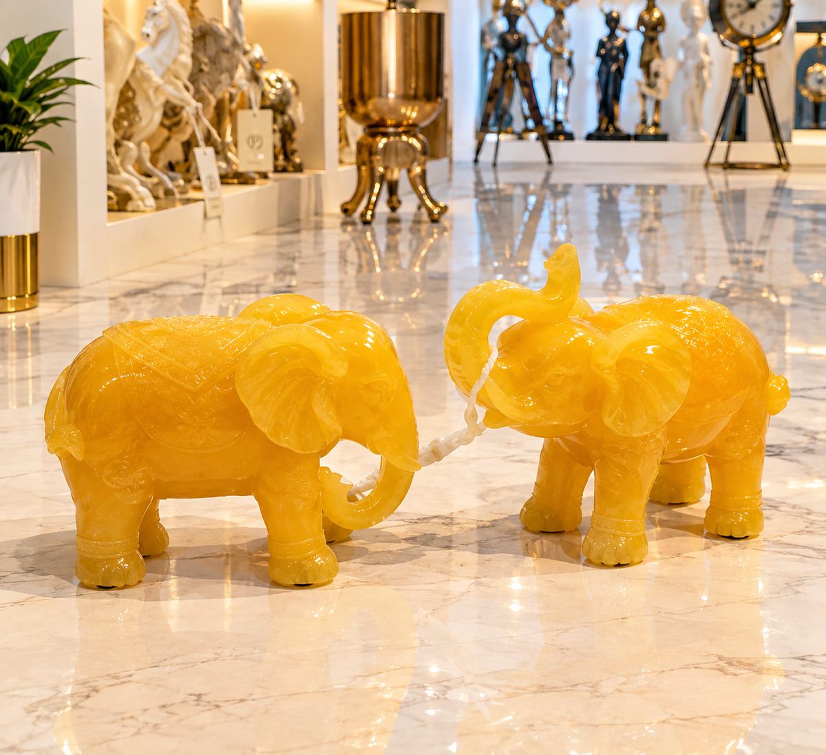pair of matching yellow jade stone elephant statues