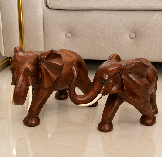 pair of hand-carved style elephant figurines