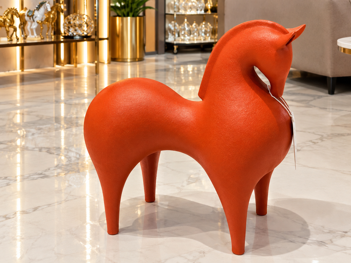 modern abstract horse floor sculpture finished in a vibrant, textured terracotta orange tone.