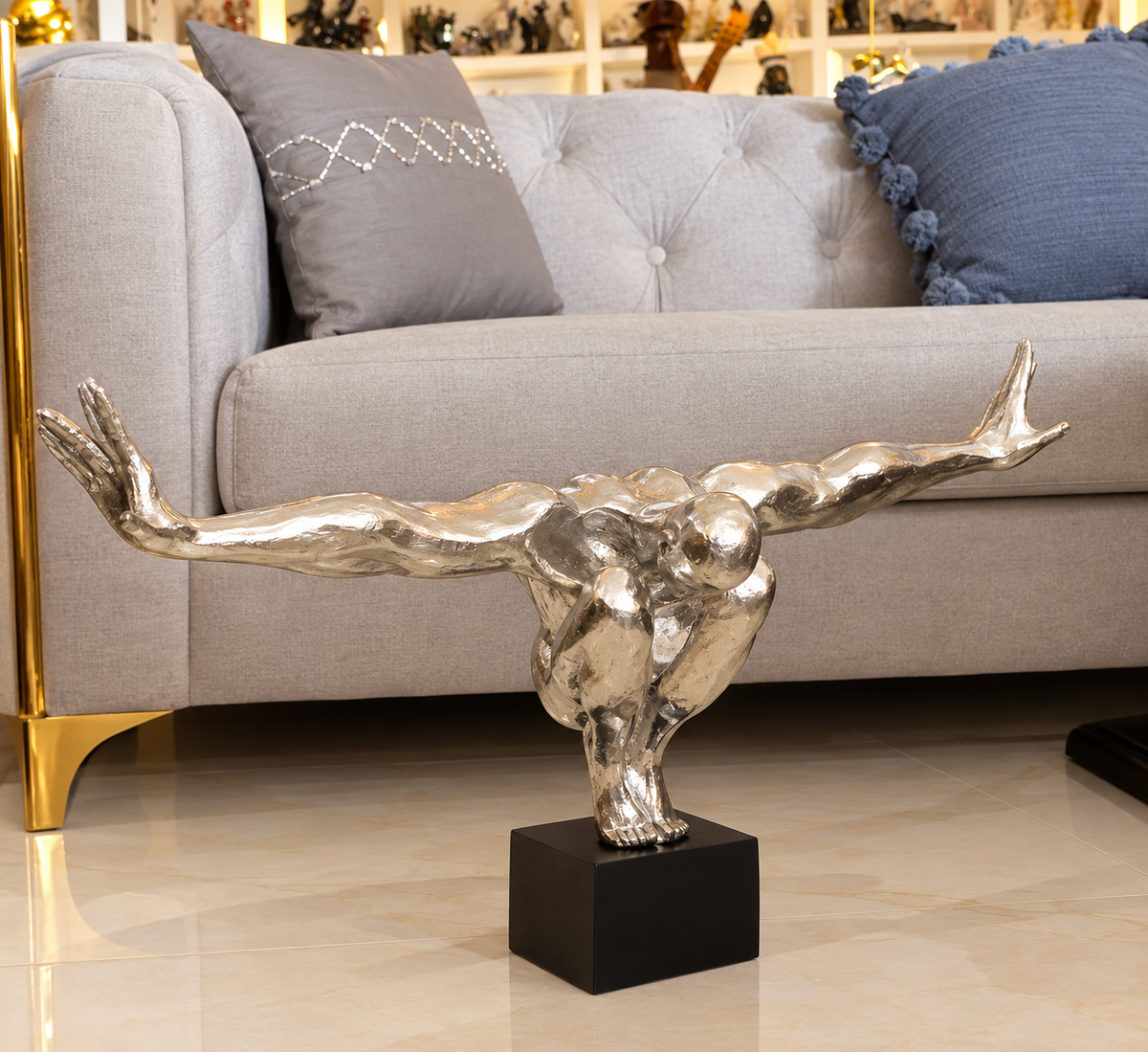 modern polished metallic diver sculpture