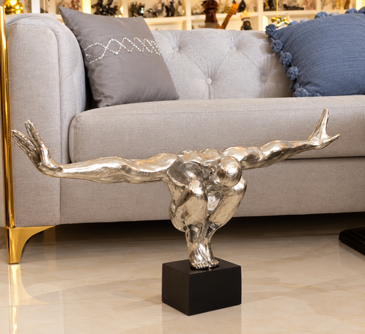 modern polished metallic diver sculpture